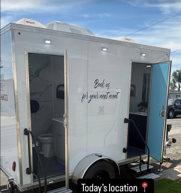The Lavatory Lounge luxury restroom trailer with open doors at a corporate event in Los Angeles